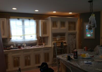 This is a cabinet painting project in Biddeford ME